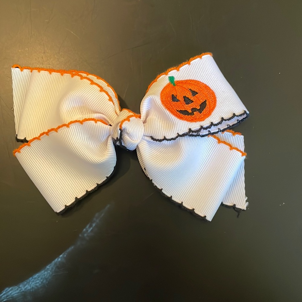 Fall and Halloween bow on a barrette-white, black and oranges-pumpkin-cute!
